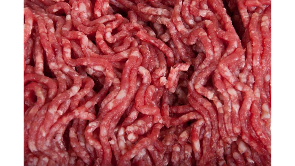 What causes ground beef to be red outside and brown inside?