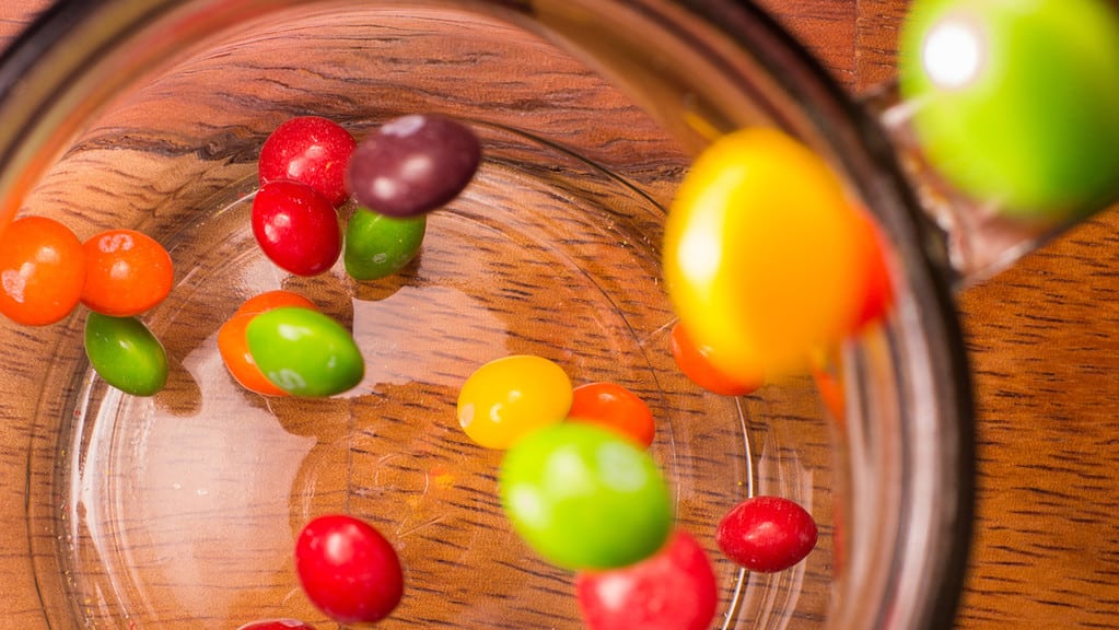 How should opened Skittles be stored?